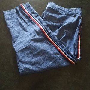 Blue pixie cut pants with red and white stripe